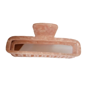 Pink marble acetate hair claw clip in rectangular design for women elegant hair styling