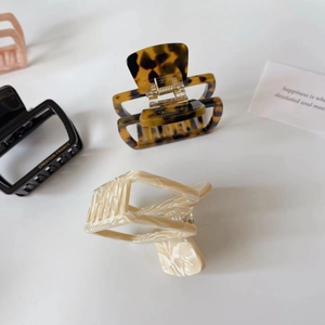 Vintage tortoiseshell, cream marble, and matte black hair claw clips set for women