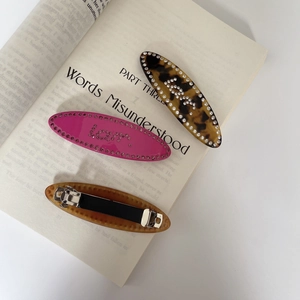 Three-piece acetate hair clip set with sparkling rhinestones and metal spring closure