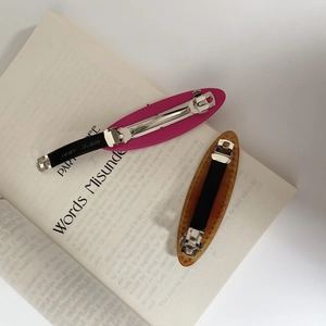 Fashionable rose pink and amber leopard print acetate hair clips with metal spring clips