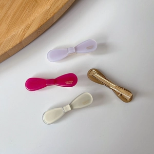 Elegant acetate bow hair clips in purple, pink, and grey with golden duckbill metal base
