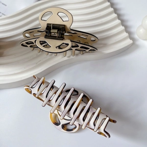 French classic acetate hair claw clips in beige and tortoiseshell hollow design