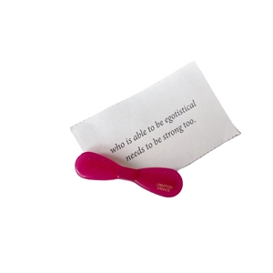 Premium rose red acetate hair clip in bow shape with Creation France lettering