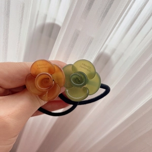 Elegant rose flower hair scrunchies in amber and green with France Handmade logo