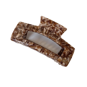 Large tortoiseshell acetate hair claw clip with marble pattern and rectangular design
