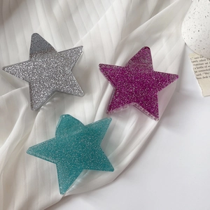 Set di tre mollette per capelli a stella in acetato con glitter nei colori argento, viola e ciano