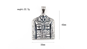 Macro detail showing a 42mm x 33mm vintage stainless steel suit pendant for men