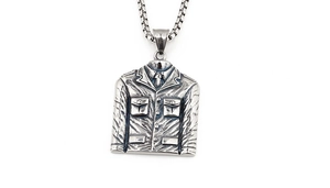 Detail of vintage punk blazer pendant featuring buttons and textured stainless steel box chain