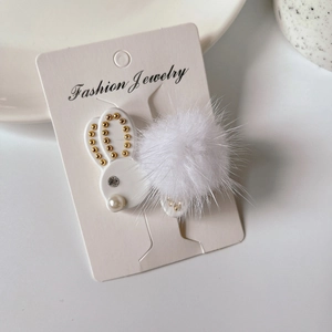 Set di fermagli per capelli a forma di coniglio bianco con pompon di peluche