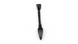 Macro shot of a black stainless steel spearhead pendant with a polished metallic finish