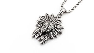 Detailed macro view of retro Indian chief pendant with intricate feather textures