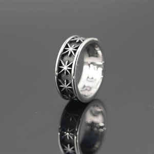 Punk style wide silver titanium steel ring featuring embossed octagonal star patterns