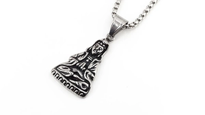 Detailed macro view of vintage silver Buddha pendant necklace with antique metal finish