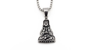 Macro shot of Buddha pendant with box chain showing vintage metallic textures