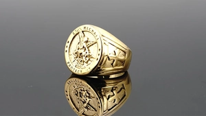 Detail of St. Michael gold signet ring with engraved prayer and cross on the side
