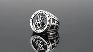 Macro detail of St. Michael relief engraving on vintage gothic style titanium steel ring