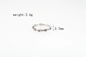 Detail view of 3.7mm wide bamboo joint ring in silver steel showing 2.6g weight specs