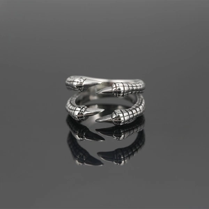 Vintage silver titanium steel four-claw eagle ring with gothic punk texture and mirror reflection