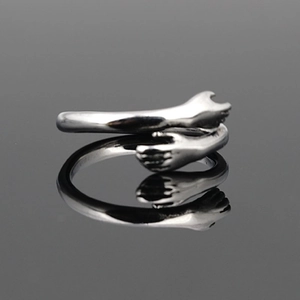 Polished titanium steel hug ring with unique embrace hand design for couples