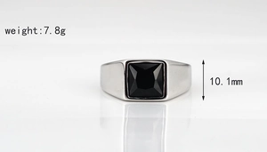 Detail of silver signet ring with black gemstone, weight 7.8g and width 10.1mm