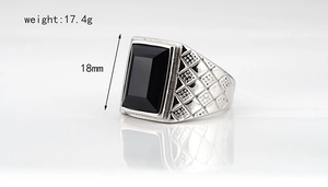 Detail shot of men's vintage striped ring with black gemstone and 18mm height dimension
