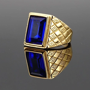 Men's vintage gold plated signet ring with large blue gemstone and striped texture