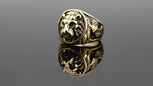 Macro detail of vintage tiger head ring with antique finish and fine mane texture