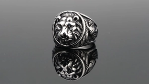 Macro detail of retro tiger head ring with vintage relief and hawk wing carving