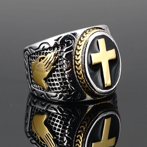 Retro stainless steel signet ring with gold cross and praying hands detail in Gothic style