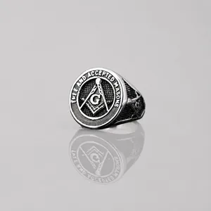 Vintage silver Freemasonry signet ring with engraved square, compass, and G symbol