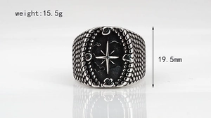 Detailed view of punk cross ring with star relief, 19.5mm height and 15.5g weight