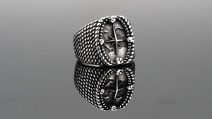 Detailed macro view of retro stainless steel ring with compass engraving and star pattern