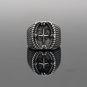 Vintage silver compass cross ring for men with scales texture and polished reflection