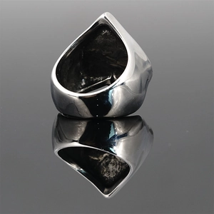 Vintage punk skull ring in shield shape with polished steel finish and mirror reflection
