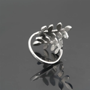 Silver stainless steel leaf branch ring featuring a natural open adjustable design