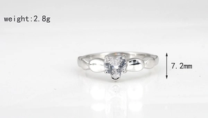 Detailed close-up showing heart-shaped zircon stone and silver titanium steel ring dimensions