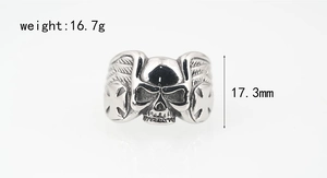 Macro view of punk skull ring with wings and cross detail showing 16.7g weight
