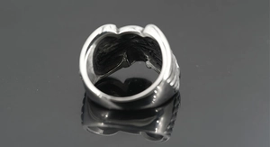 Macro view showing the vintage texture and hollow back design of the skull ring