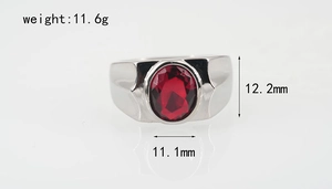 Detail view of titanium steel ring featuring an oval red zircon stone and polished finish
