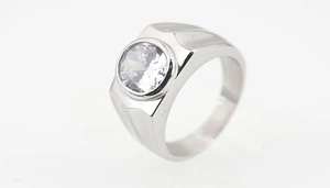 Macro view of wide silver ring for men featuring a large round zircon and side grooves