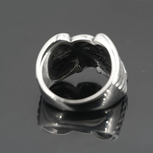 Vintage oxidized silver titanium steel ring with ribbed texture and heavy skull design