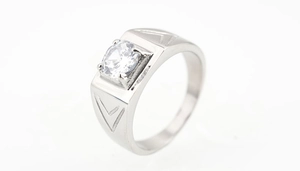 Detailed view of silver titanium steel men's ring with central zircon and V-carved side patterns