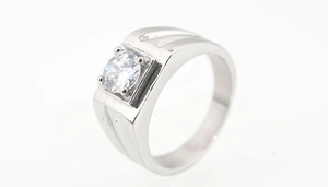 Macro shot of men titanium steel ring with round zircon inlay and brushed inner band