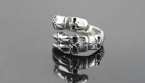 Macro shot of punk style titanium steel ring with vintage skull embossed patterns