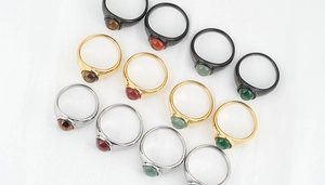Detailed view of minimalist titanium steel rings with natural tiger eye and agate stones