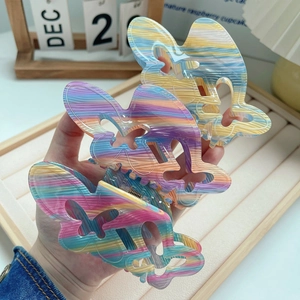 Three-piece acrylic butterfly hair claw clip set with colorful iridescent stripes design