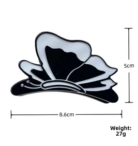 Detail showing dimensions of 8.6cm by 5cm for the black and white acetate butterfly clip
