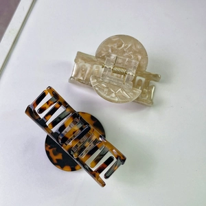Elegant marble and tortoise shell acetate hair claws with premium gold metal springs
