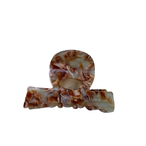 Elegant geometric acetate hair claw with marble pattern in red brown and beige colors