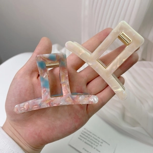 Elegant acetate geometric claw clips with colorful stone pattern and cream pearl finish